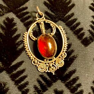 Genuine Amber and Sterling silver pendant.